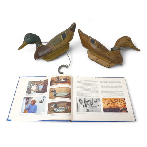 248 - A pair of early 20th century American decoy ducks, carved and painted wood, both signed and inscribe... 