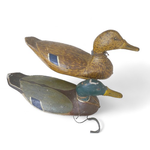 248 - A pair of early 20th century American decoy ducks, carved and painted wood, both signed and inscribe... 