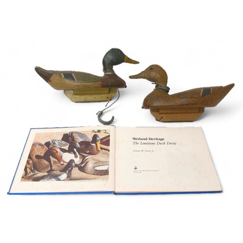 248 - A pair of early 20th century American decoy ducks, carved and painted wood, both signed and inscribe... 