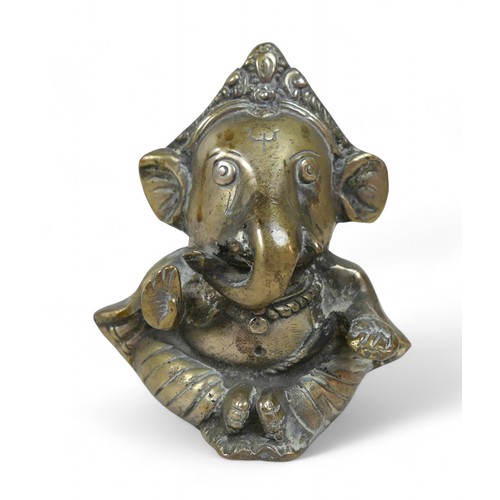 199 - A 20th century Indian Hindu bronze figure depicting the elephant god Ganesha, 10 by 8 by11cm high.