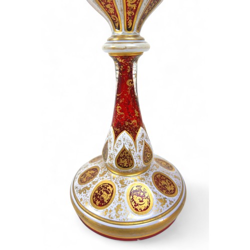 192 - A late 19th early 20th century Bohemian overlay glass goblet vase, 12 by 36cm high.