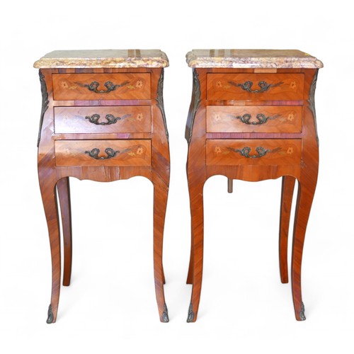 347 - A pair of early to mid 20th century French bombe shaped cherry wood nightstands, with gilt metal mou... 