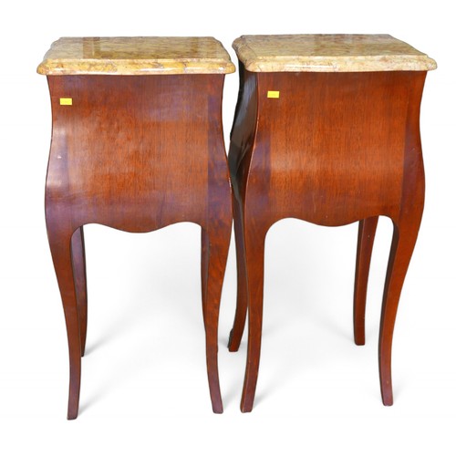 347 - A pair of early to mid 20th century French bombe shaped cherry wood nightstands, with gilt metal mou... 