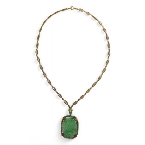 11 - A 14ct yellow gold mounted carved jade pendant with seed pearl and enamel border on a 14ct fancy lin... 