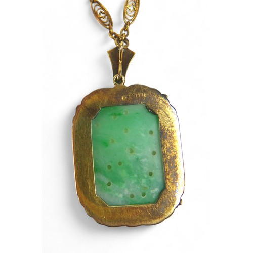 11 - A 14ct yellow gold mounted carved jade pendant with seed pearl and enamel border on a 14ct fancy lin... 