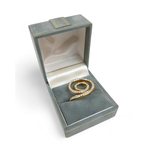 45 - An 18ct yellow gold diamond spiral ring, 24 by 22 by 19mm high, size M, 5.5g.