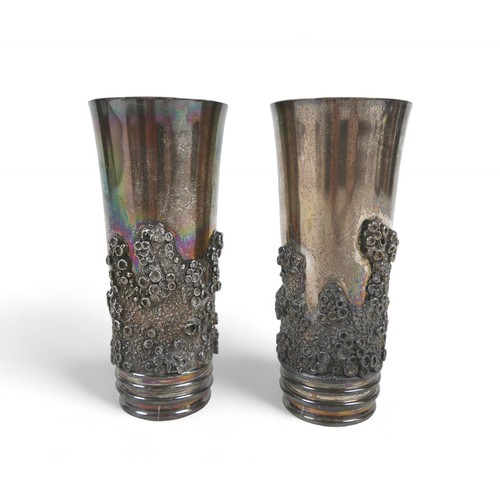 84 - A pair of silver beakers, the tapered body decorated with applied barnacle decoration and garnets, g... 