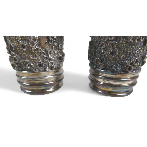 84 - A pair of silver beakers, the tapered body decorated with applied barnacle decoration and garnets, g... 