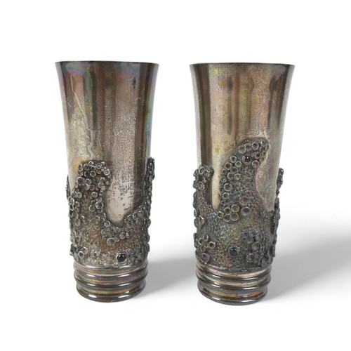 84 - A pair of silver beakers, the tapered body decorated with applied barnacle decoration and garnets, g... 