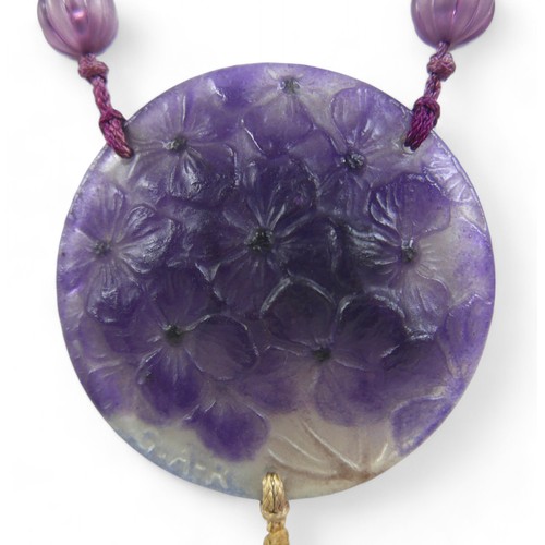 42 - A Gabriel Argy-Rousseau glass pendant necklace, in the pattern 'Hydrangeas', circa 1920s, on purple ... 