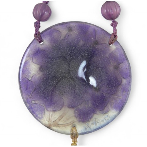 42 - A Gabriel Argy-Rousseau glass pendant necklace, in the pattern 'Hydrangeas', circa 1920s, on purple ... 