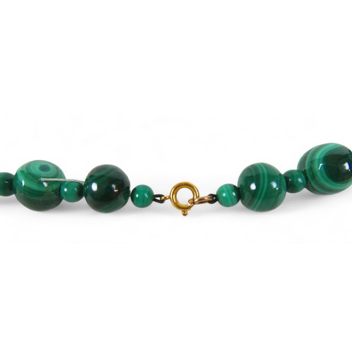 14 - A malachite bead necklace, formed of 46 graduating beads, separated by 48 smaller beads, with 9ct go... 