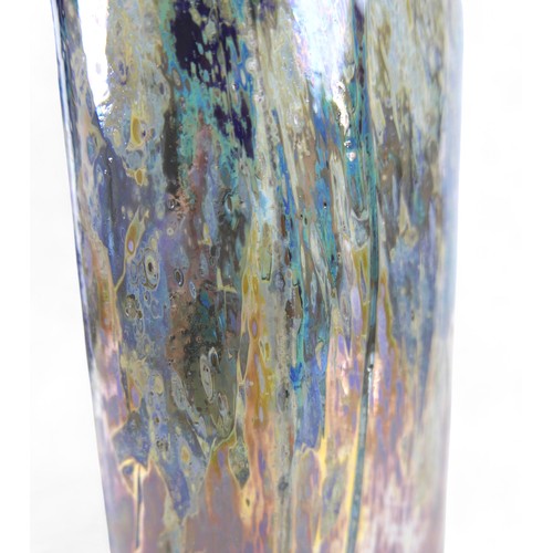 195 - A tall studio art glass vase by Sam Herman (1936-2020), the surface decorated with metallic oxide ir... 