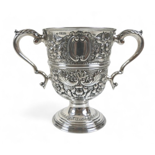 80 - An Edward VII silver twin handle trophy cup with embossed decoration William Hutton & Sons Ltd Sheff... 