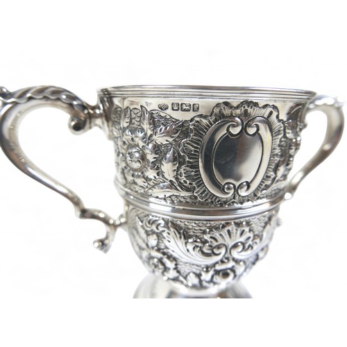 80 - An Edward VII silver twin handle trophy cup with embossed decoration William Hutton & Sons Ltd Sheff... 