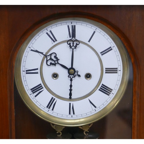 254 - An early 20th century regulator clock, with Roman numeral dial, twin train movement, pendulum and we... 