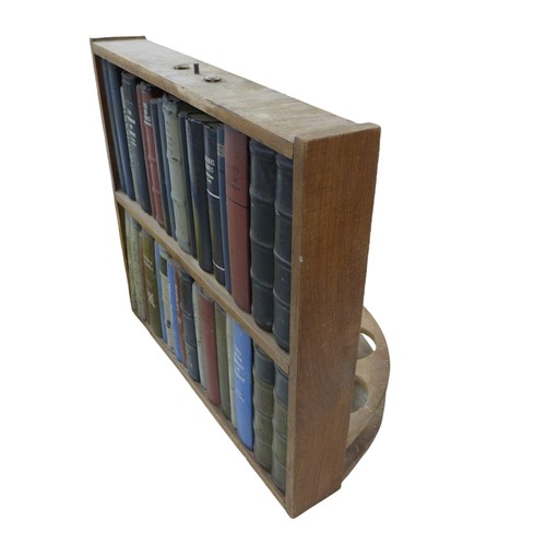 205 - A faux bookcase wine bottle stand, with mirror back, 56 by 32.5 by 51.5cm high.