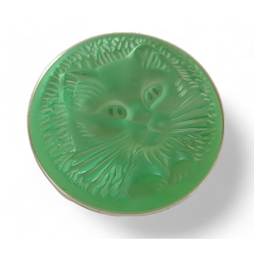 32 - Two modern Lalique glass brooches, a green glass cats face and a blue glass flower head, 4.5 and 4cm... 