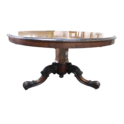 349 - A Victorian burr walnut circular breakfast table, on a carved tripod base terminating on scroll ends... 