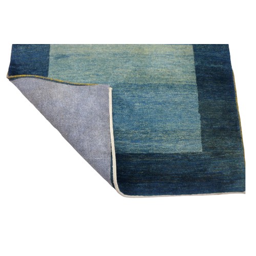 365 - A Gabbeh rug with a dark green teal border and a green central rectangle, 245 by 179cm.