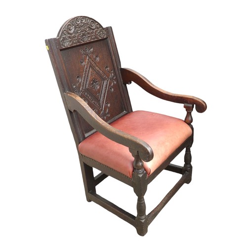 350 - A 17th century oak Wainscot chair, with red leather upholstered seat, 106 by 45 by 57cm.