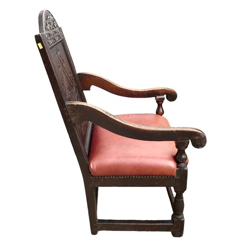 350 - A 17th century oak Wainscot chair, with red leather upholstered seat, 106 by 45 by 57cm.