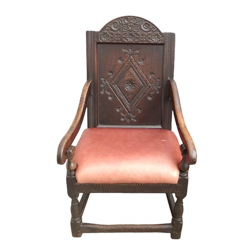 350 - A 17th century oak Wainscot chair, with red leather upholstered seat, 106 by 45 by 57cm.