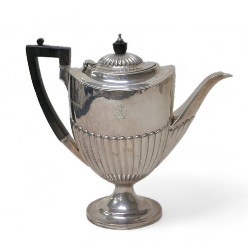 87 - A Victorian four-piece silver tea set, comprising a teapot 28 by 12.5 by 16.5cm high, a coffee pot, ... 