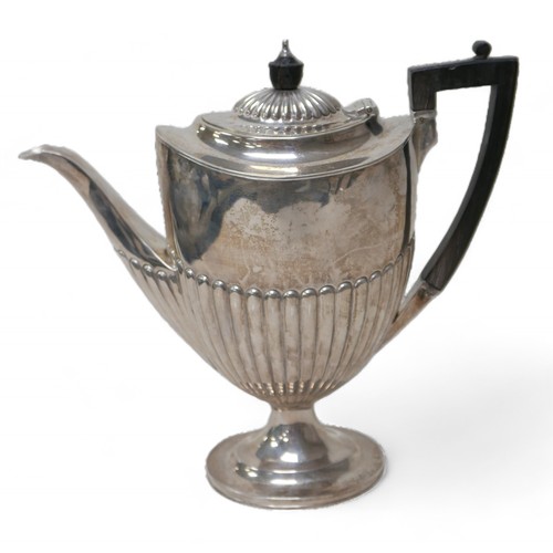 87 - A Victorian four-piece silver tea set, comprising a teapot 28 by 12.5 by 16.5cm high, a coffee pot, ... 