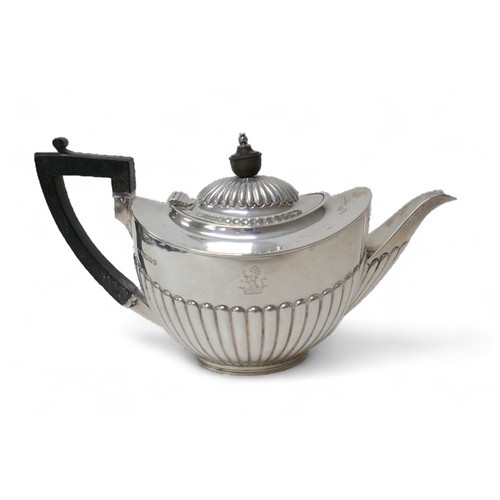 87 - A Victorian four-piece silver tea set, comprising a teapot 28 by 12.5 by 16.5cm high, a coffee pot, ... 