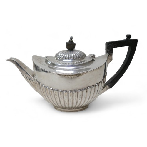 87 - A Victorian four-piece silver tea set, comprising a teapot 28 by 12.5 by 16.5cm high, a coffee pot, ... 