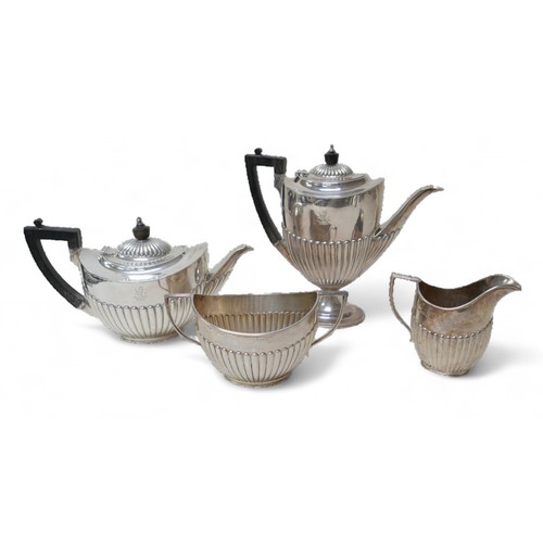 87 - A Victorian four-piece silver tea set, comprising a teapot 28 by 12.5 by 16.5cm high, a coffee pot, ... 