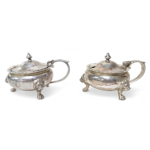 77 - Four ERII silver condiment pots, comprising two lidded mustard pot (each 9.5 by 7 by 5.5cm high) and... 