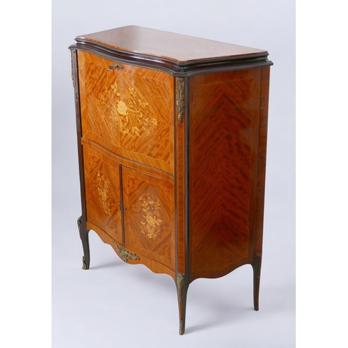 368 - A 1950s walnut cocktail cabinet, in French 18th century style, with peach glass liner, mirrored inte... 