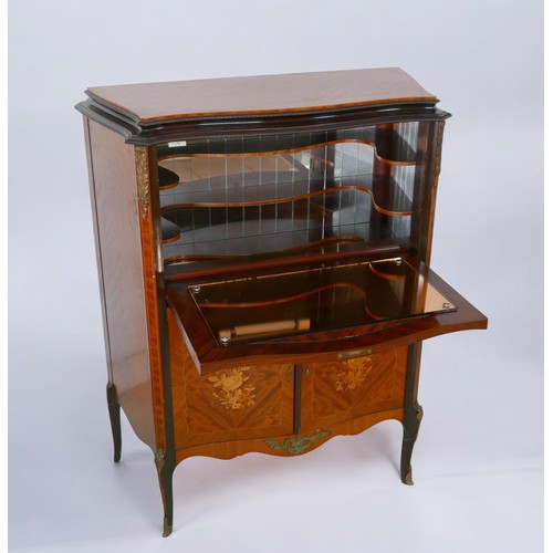 368 - A 1950s walnut cocktail cabinet, in French 18th century style, with peach glass liner, mirrored inte... 