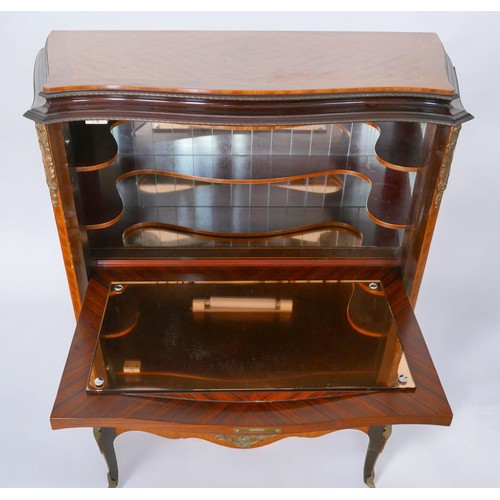 368 - A 1950s walnut cocktail cabinet, in French 18th century style, with peach glass liner, mirrored inte... 