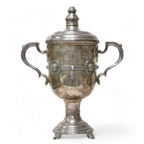 88 - A George V Irish silver twin handled trophy, with Celtic knot banding, with presentation inscription... 