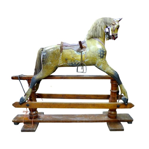 245 - A large Victorian dapple grey painted rocking horse, with leather saddle and tack, 152 by 40 by 126c... 