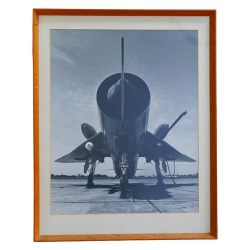 283 - A 20th century black and white photographic print of a Lightning jet, 50 by 40.5cm,  glazed and fram... 