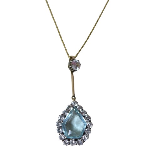 60 - A white sapphire and pale blue topaz pendant, on unmarked gold mounts, testing as at least 9ct gold,... 