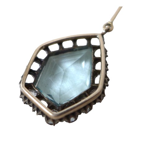 60 - A white sapphire and pale blue topaz pendant, on unmarked gold mounts, testing as at least 9ct gold,... 