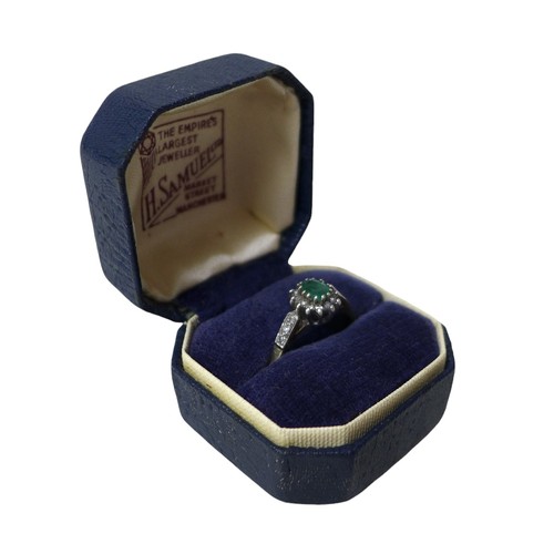 57 - A 9ct gold, emerald and diamond flowerhead ring, set with an oval-cut emerald and ring of small diam... 