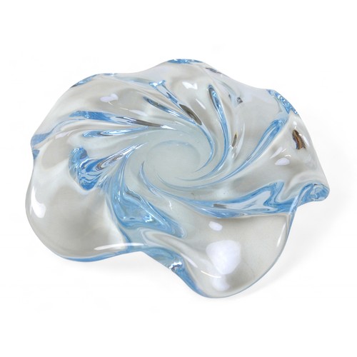 134 - A Swedish art glass low bowl by Edvin Ohrstrom, the tinted blue glass moulded in a swirl design, sig... 