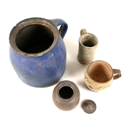 137 - A collection of four pottery items, comprising a blue glazed jug with handle, 17 by 16.5cm high, a s... 