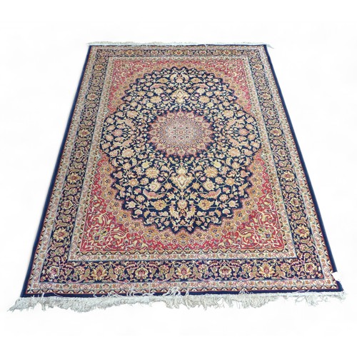 322 - Two modern machine made rugs, blue ground rug, 280 by 200cm, red ground rug, 160 by 228cm.