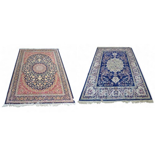 322 - Two modern machine made rugs, blue ground rug, 280 by 200cm, red ground rug, 160 by 228cm.