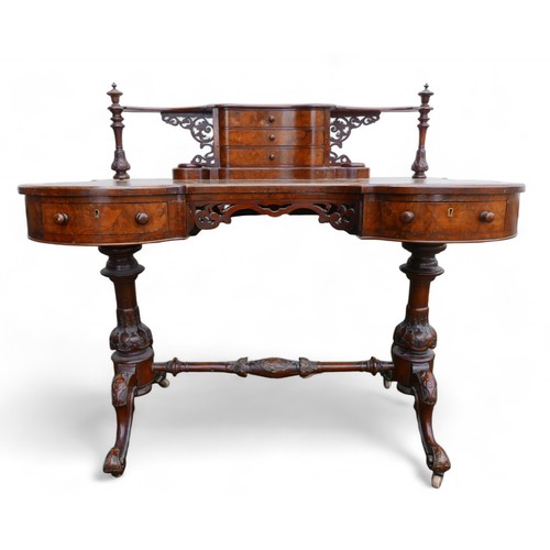 343 - A Victorian burr walnut writing table, with a serpentine three drawer upstand on a shaped leather in... 