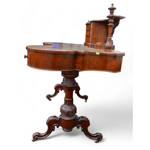 343 - A Victorian burr walnut writing table, with a serpentine three drawer upstand on a shaped leather in... 