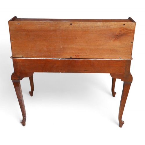 315 - A Chippendale style mahogany desk, with cubby holes, letter racks, drawers to its galleried top, rai... 