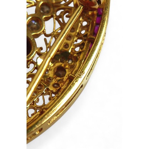 3 - An 18ct gold diamond and ruby oval form brooch, with round cut diamonds and rubies central round cut... 